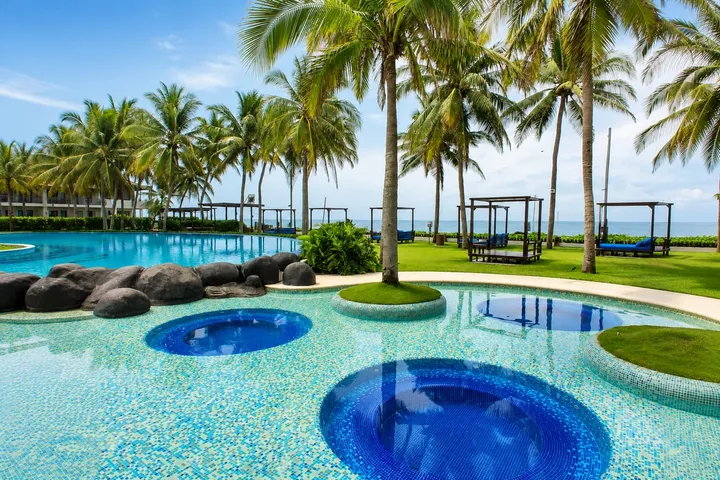 Pools and daybeds facing the sea