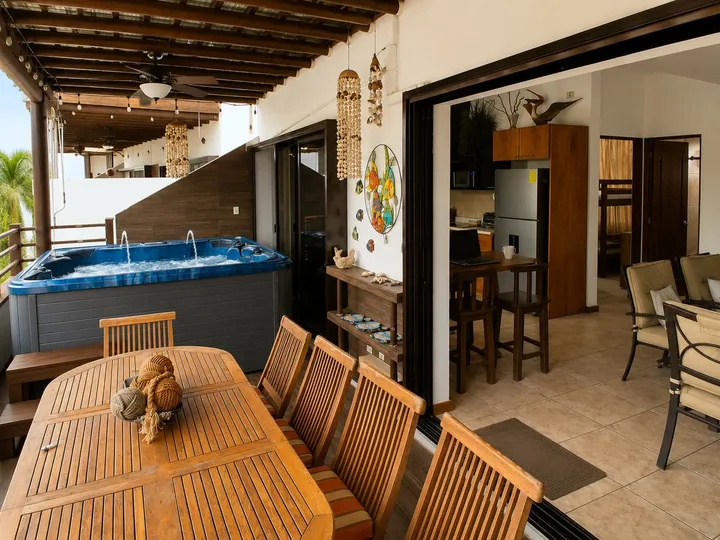 The terrace: jacuzzi, dining and kitchen